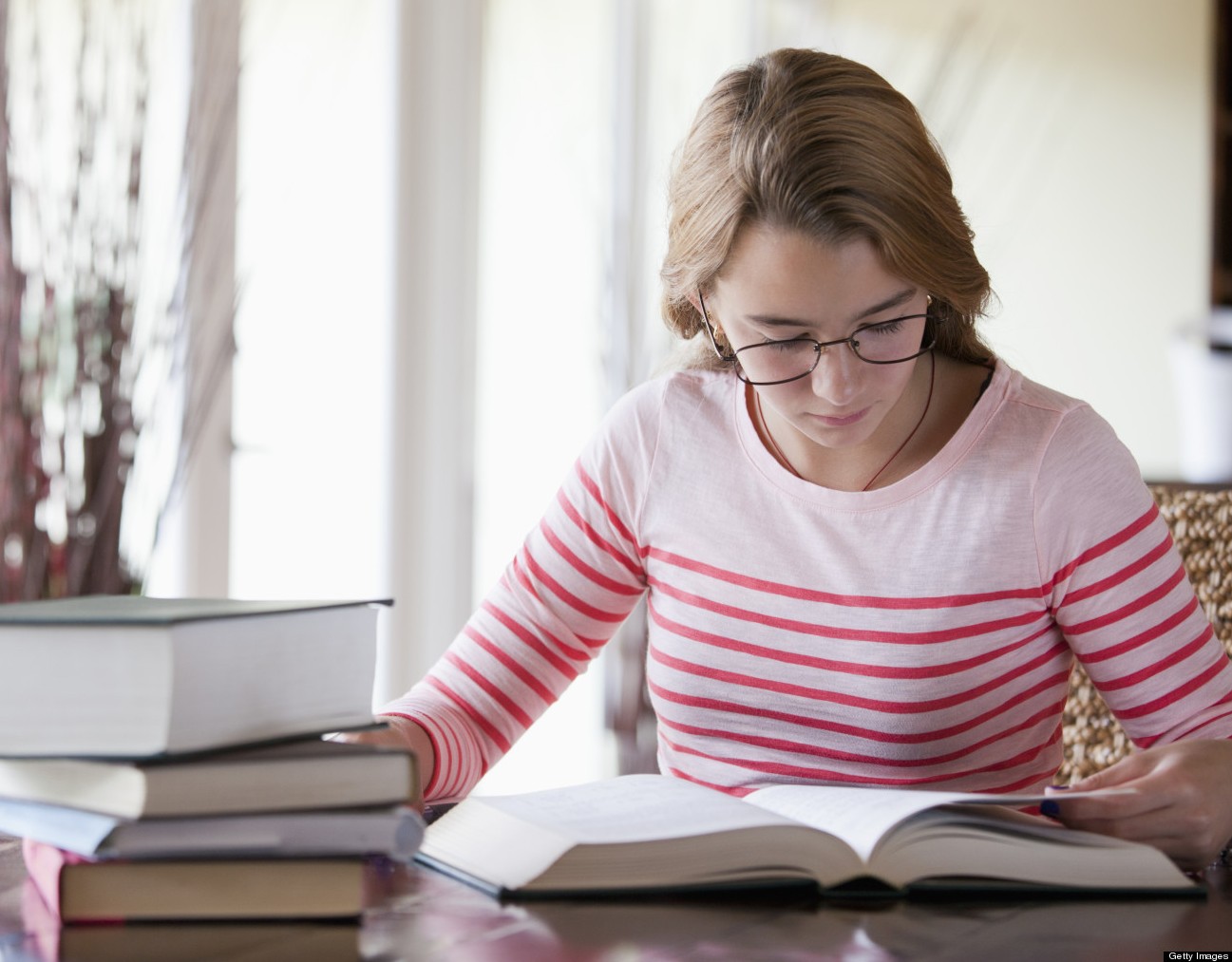 Busy girl doing homework